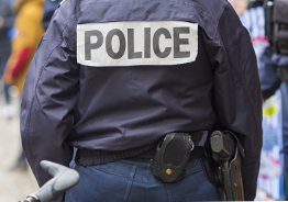 Police officer wearing blue police jacket